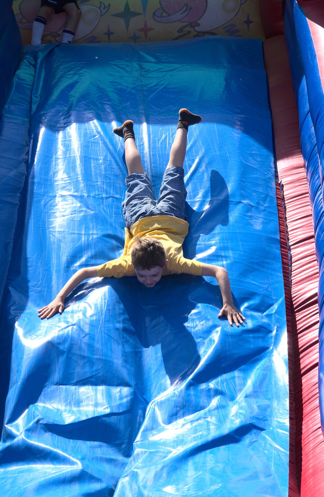 Meanwhile, Fred slides down an inflatable slide from Isobel's 10km Run, Alton Water, Stutton, Suffolk - 6th May 2018