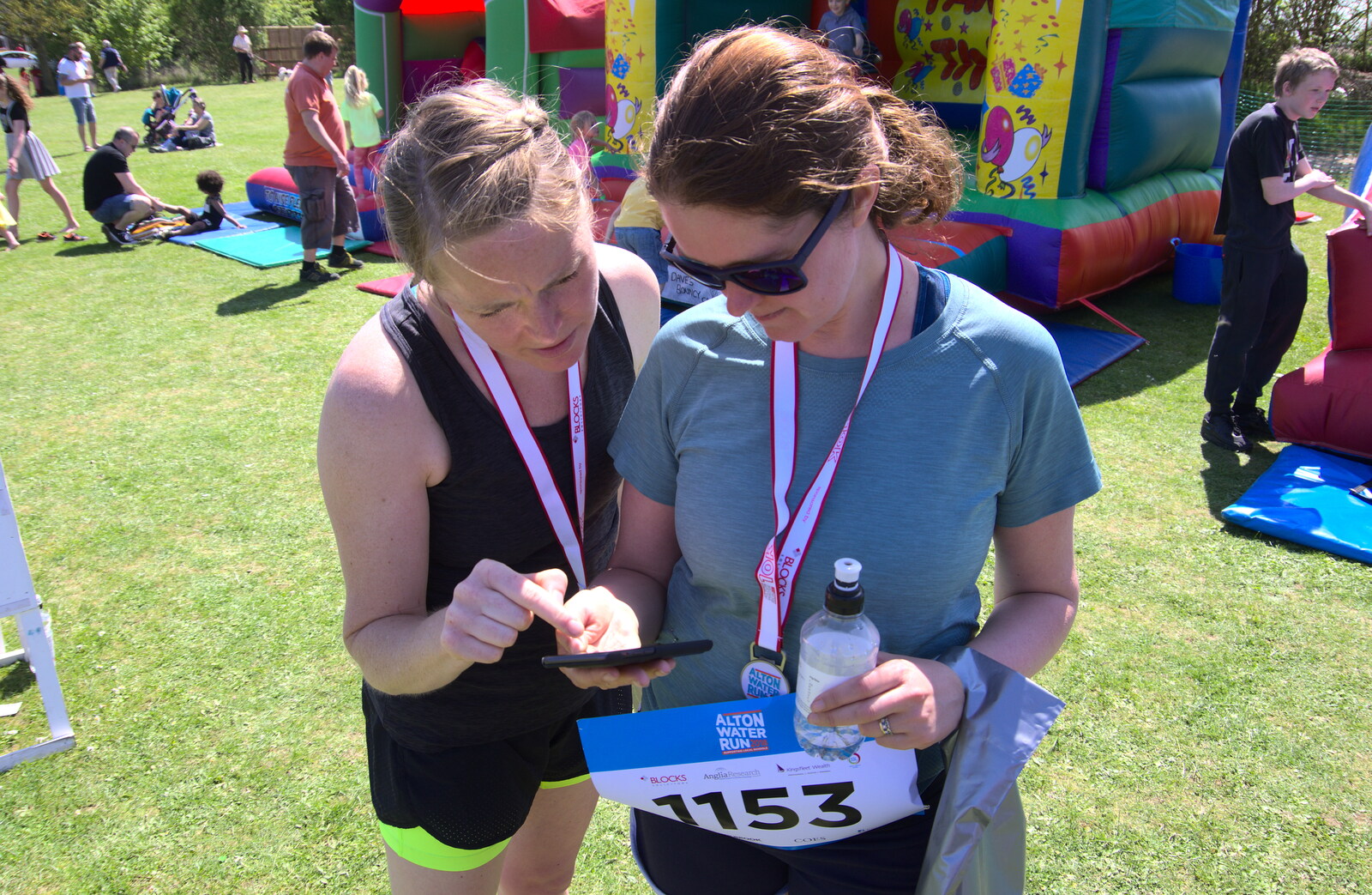 Isobel flicks through race results from Isobel's 10km Run, Alton Water, Stutton, Suffolk - 6th May 2018