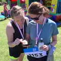 Isobel flicks through race results, Isobel's 10km Run, Alton Water, Stutton, Suffolk - 6th May 2018