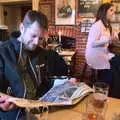 The Boy Phil reads the paper in The Victoria, A Bike Ride to the Railway Tavern, Mellis, Suffolk - 7th May 2018