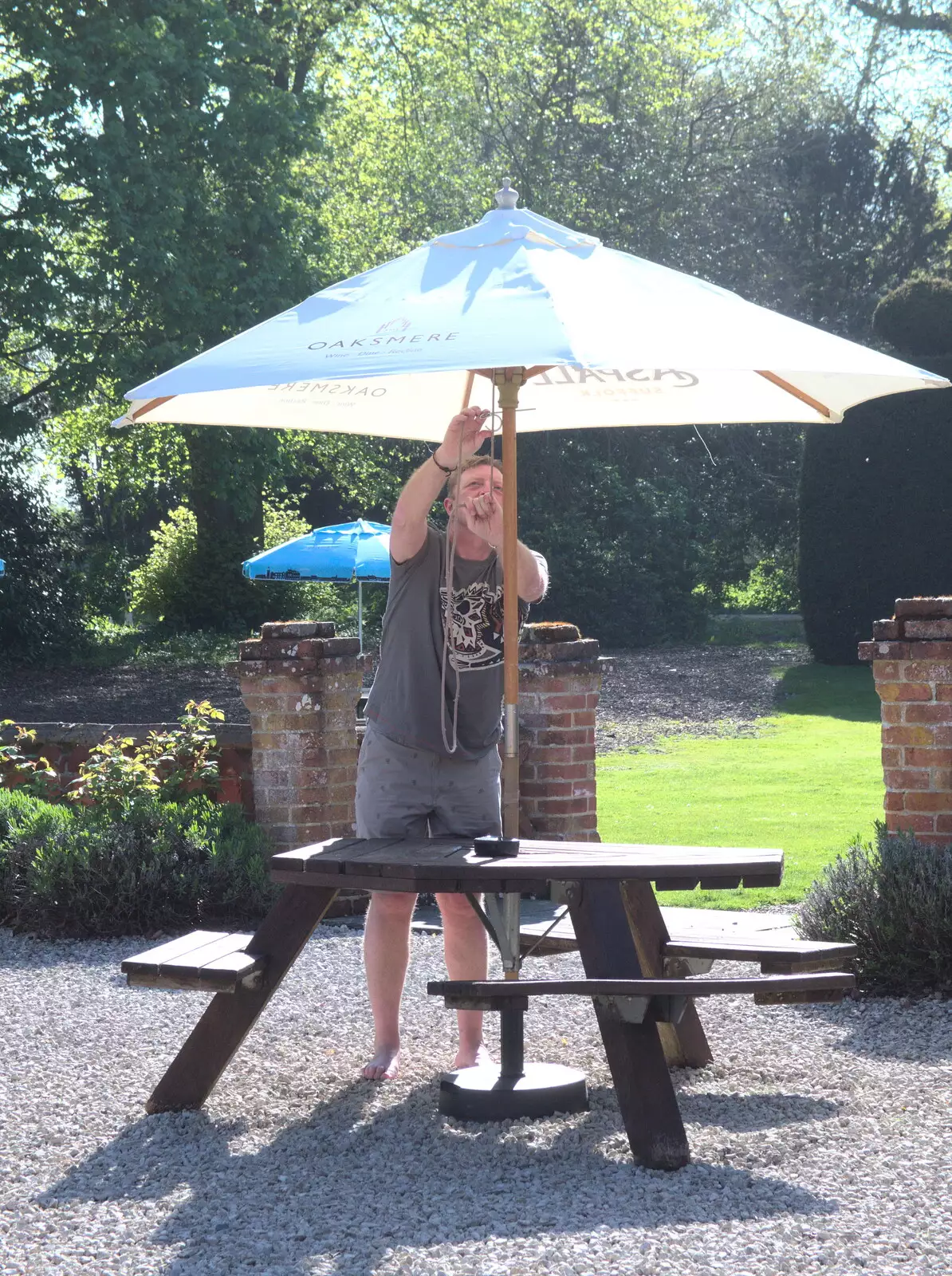 Gaz fights with a parasol at the Oaksmere, from A Bike Ride to the Railway Tavern, Mellis, Suffolk - 7th May 2018