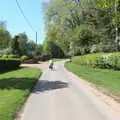 Isobel cycles past the church in Thrandeston, A Bike Ride to the Railway Tavern, Mellis, Suffolk - 7th May 2018