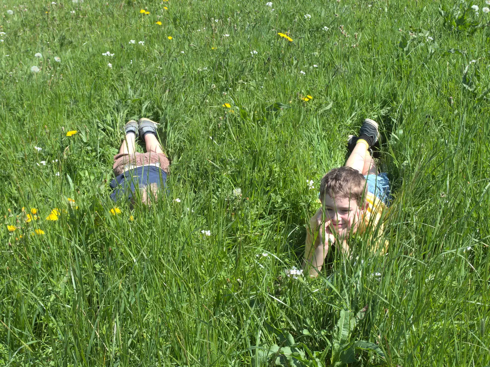 The boys relax in the long grass, from A Bike Ride to the Railway Tavern, Mellis, Suffolk - 7th May 2018