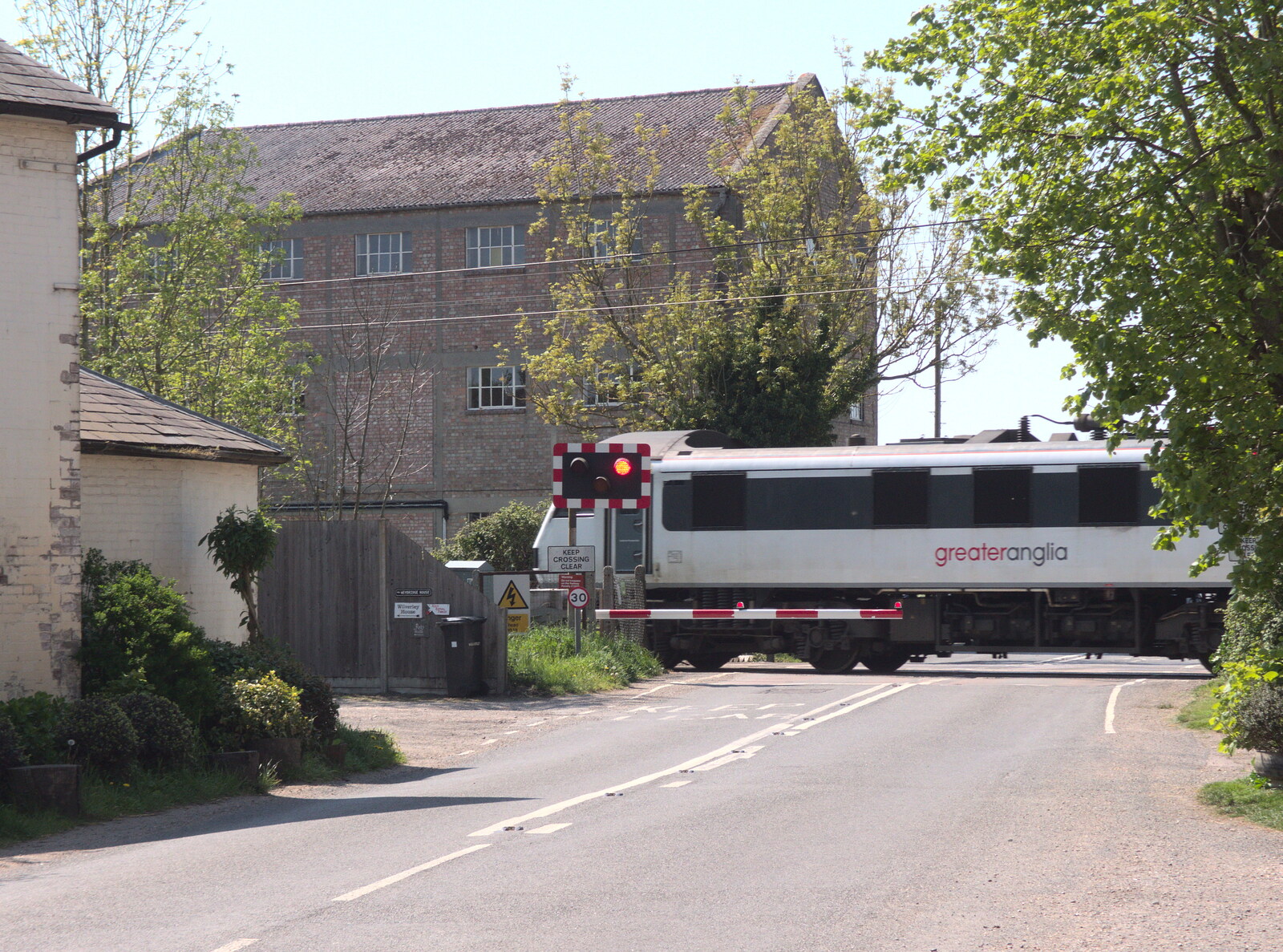 A Greater Anglia Class 90 on the crossing from A Bike Ride to the Railway Tavern, Mellis, Suffolk - 7th May 2018