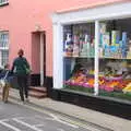 Harry and Isobel pass by a proper old-school shop, The BSCC Weekend Away, Holt, Norfolk - 12th May 2018