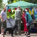 The dog roams around looking for more scraps, A Right Royal Wedding at the Village Hall, Brome, Suffolk - 19th May 2018