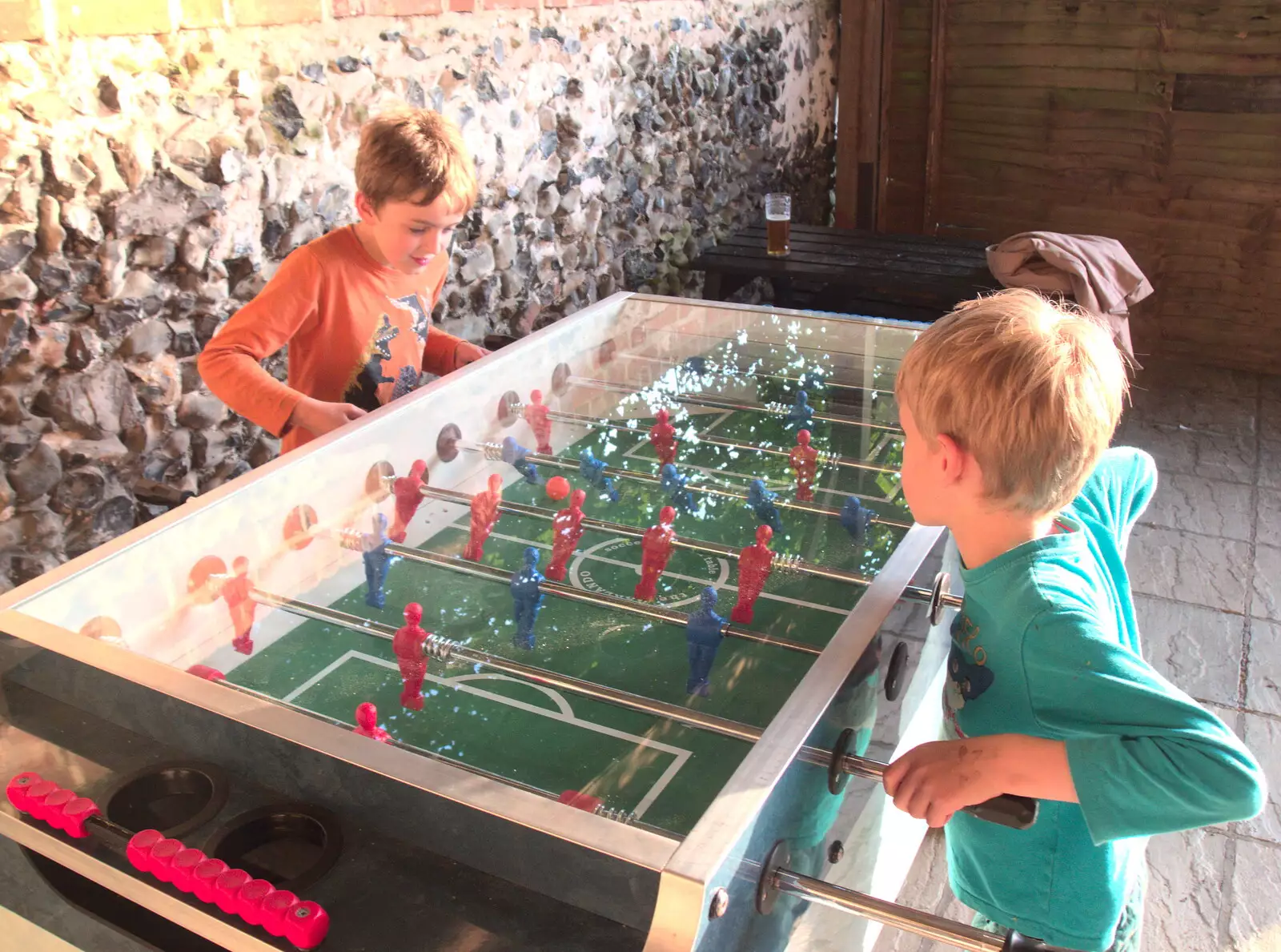 Fred and Harry get stuck into a game of fussball, from Dower House Camping, West Harling, Norfolk - 27th May 2018