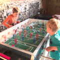 Fred and Harry get stuck into a game of fussball, Dower House Camping, West Harling, Norfolk - 27th May 2018
