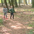 Harry and new friend Isobel run through the forest, Dower House Camping, West Harling, Norfolk - 27th May 2018