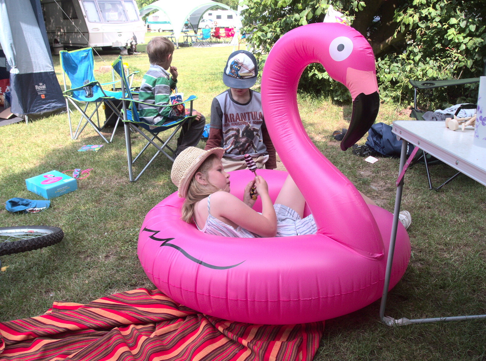 Grace lolls around in a big inflatable flamingo from Dower House Camping, West Harling, Norfolk - 27th May 2018