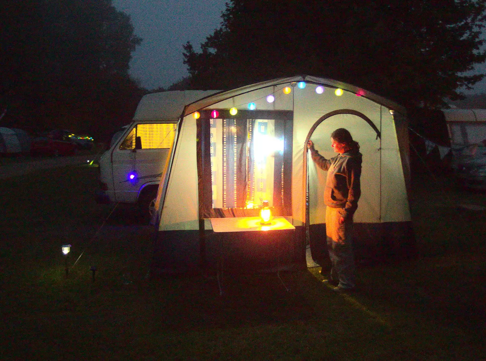 Isobel zips up the awning in the dusk, from Dower House Camping, West Harling, Norfolk - 27th May 2018