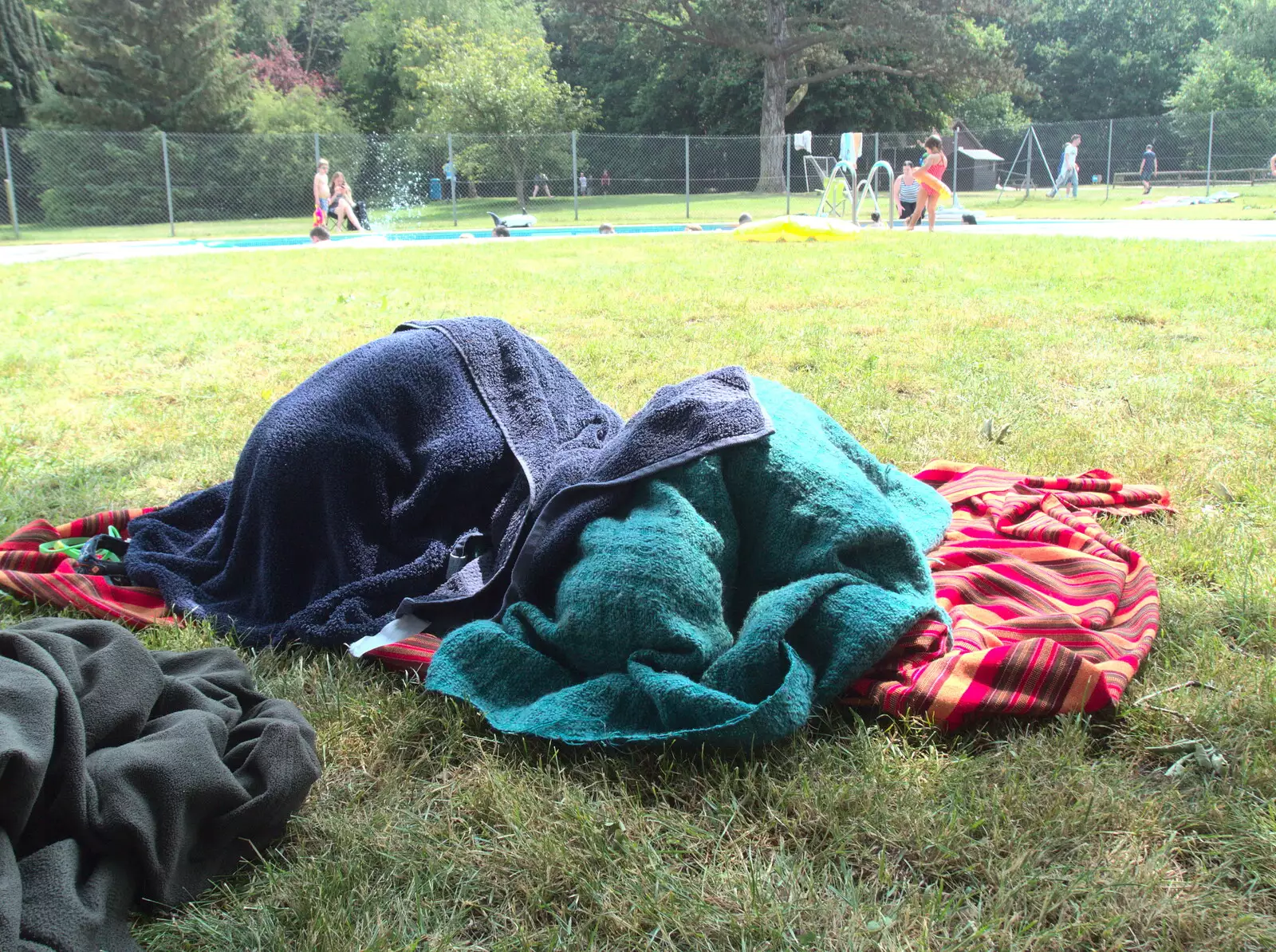 The boys huddle under towels to dry off, from Dower House Camping, West Harling, Norfolk - 27th May 2018