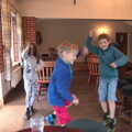 Isobel, Harry and Fred leap around in the clubhouse, Dower House Camping, West Harling, Norfolk - 27th May 2018
