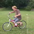 Wavy tries to ride a bike with reversed steering, The Not-Opening of the Palgrave Playground, Palgrave, Suffolk - 3rd June 2018