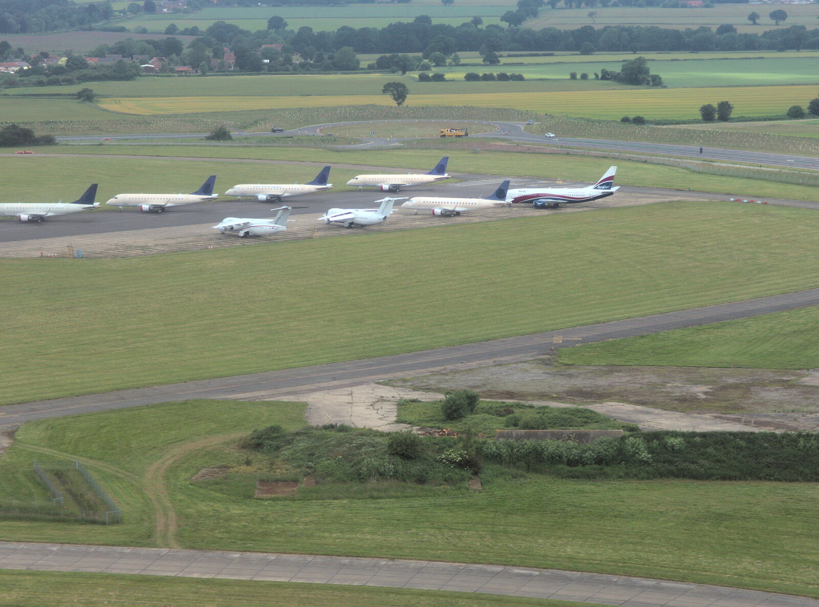 Norwich Airport has quite the collection of planes from A Postcard From Asperen, Gelderland, Netherlands - 9th June 2018