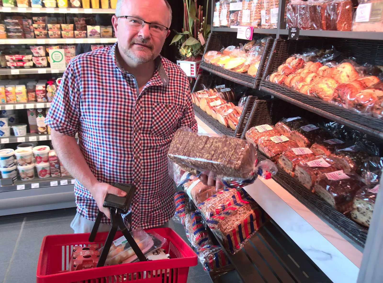 Hamish chooses some bread, from A Postcard From Asperen, Gelderland, Netherlands - 9th June 2018