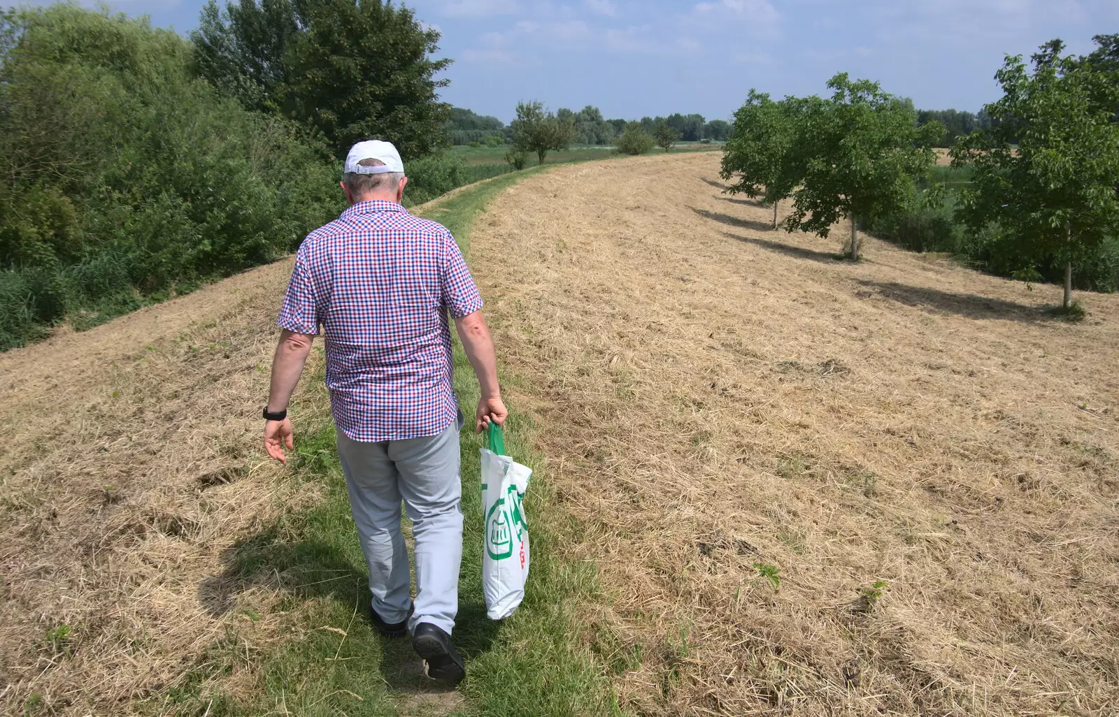 Hamish walks along a dyke, from A Postcard From Asperen, Gelderland, Netherlands - 9th June 2018