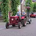 An Farmall D-217 tractor rumbles down Voorstraat, A Postcard From Asperen, Gelderland, Netherlands - 9th June 2018