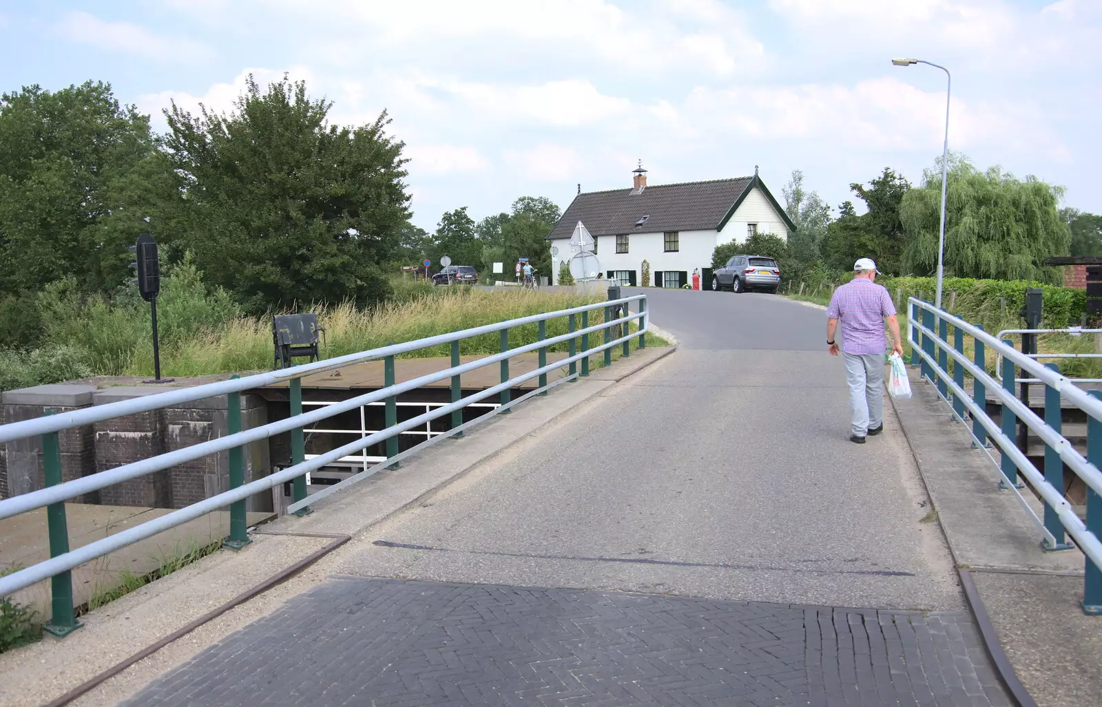 Hamish walks over the bridge, from A Postcard From Asperen, Gelderland, Netherlands - 9th June 2018