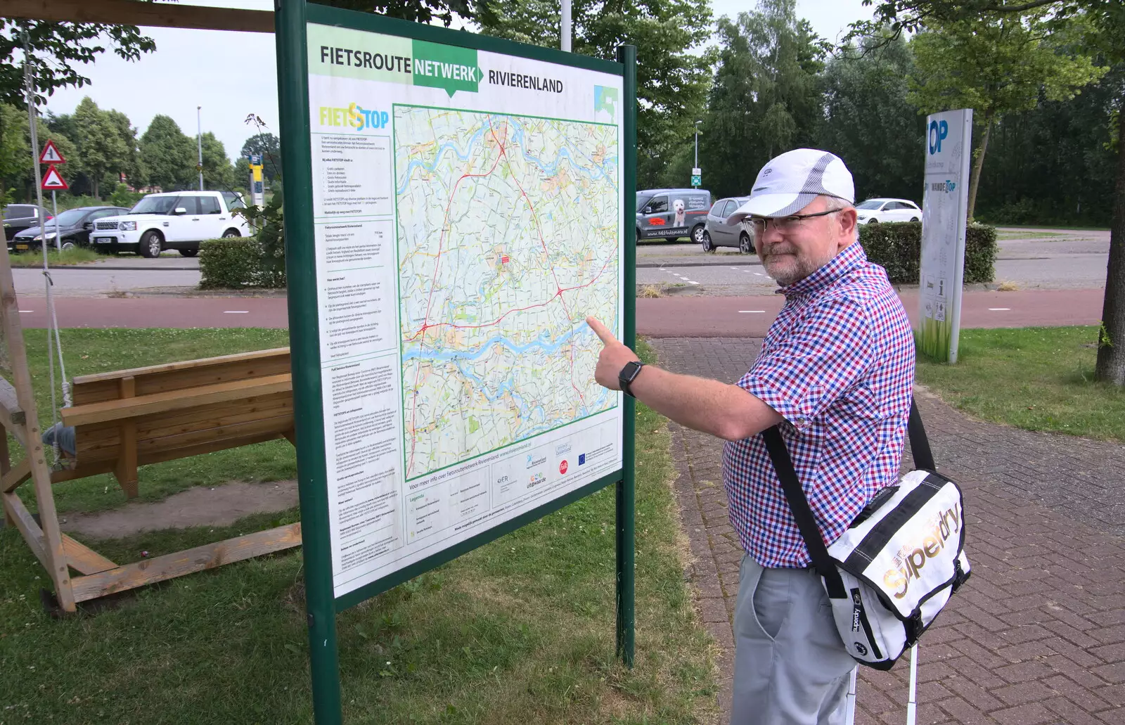 Hamish points to a cycle route sign, from Martin's James Bond 50th Birthday, Asperen, Gelderland, Netherlands - 9th June 2018