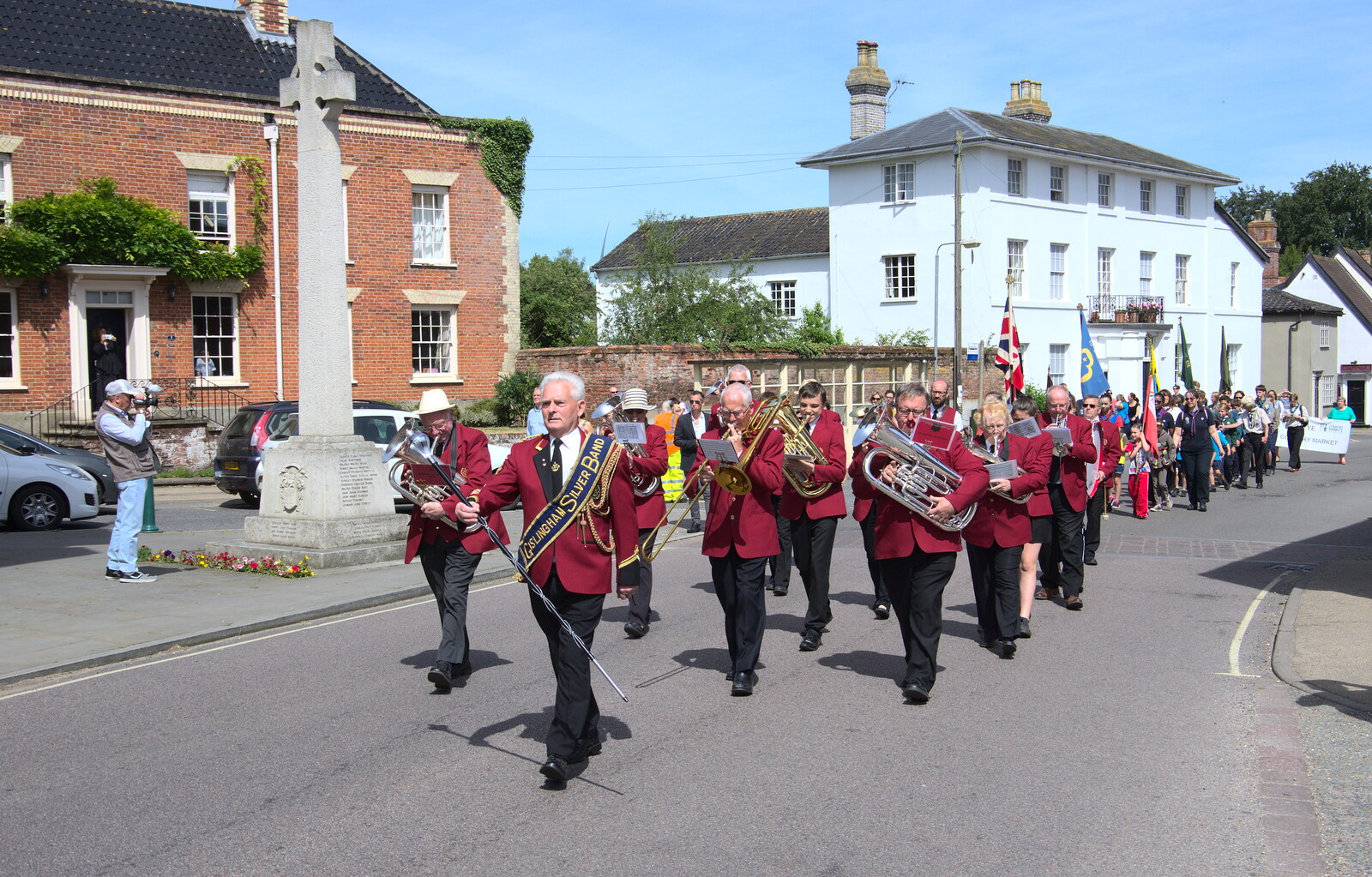 The band passes the war memorial from The Mayor Making Parade, Eye, Suffolk - 24th June 2018