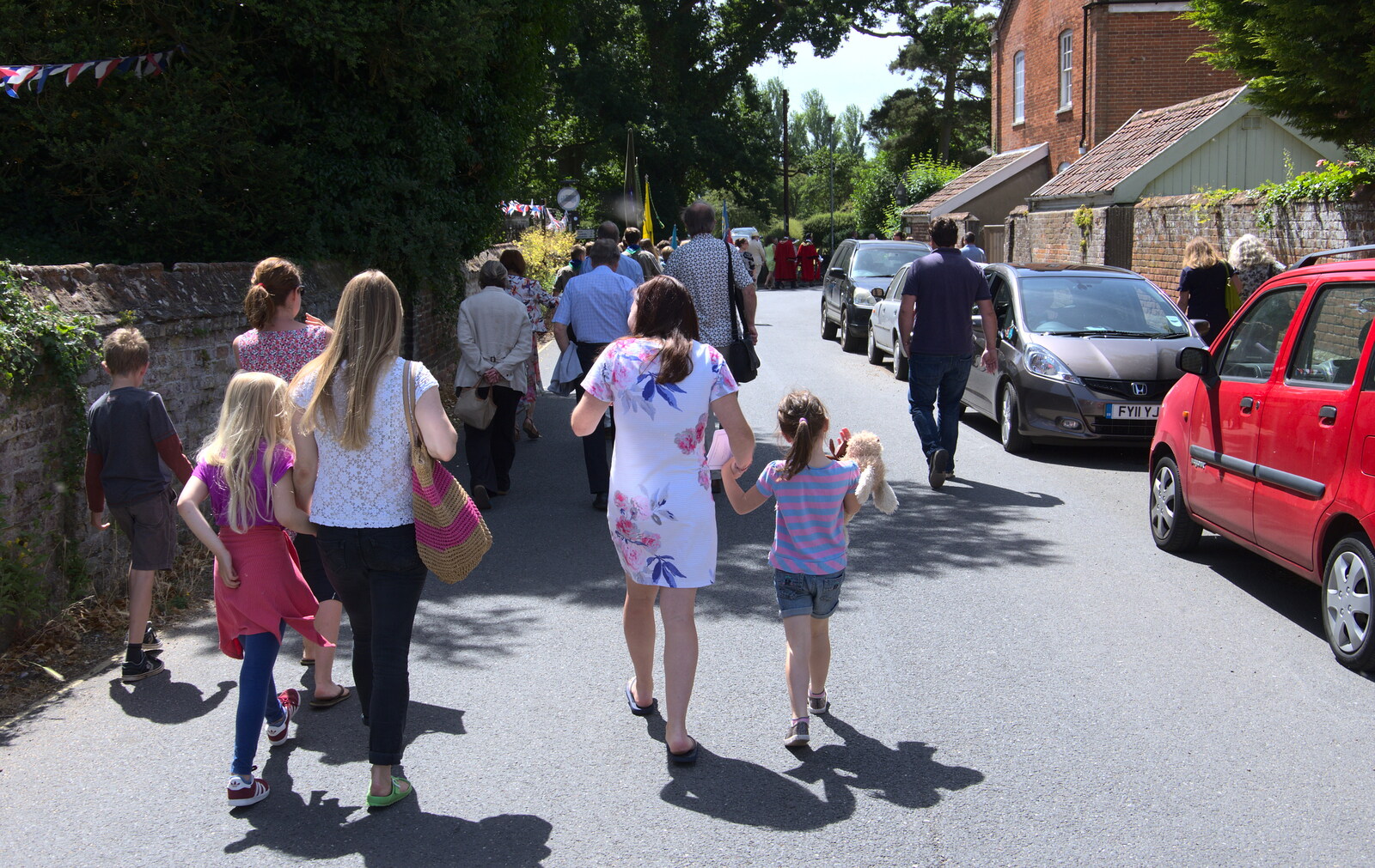 A small crowd follows the parade up Church Street from The Mayor Making Parade, Eye, Suffolk - 24th June 2018