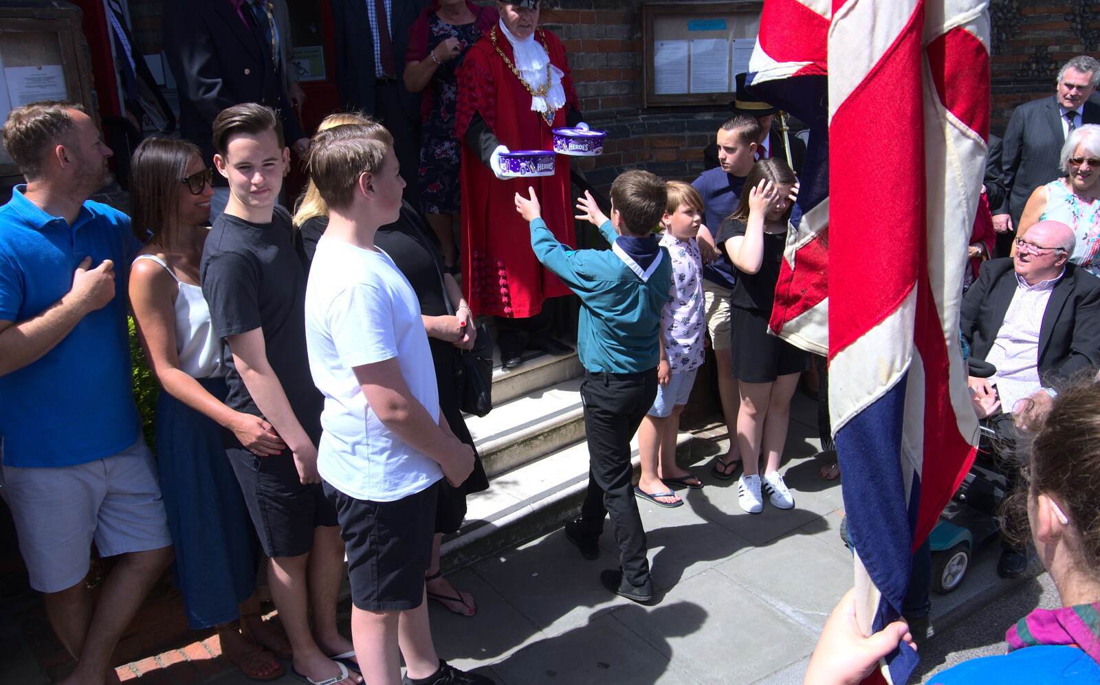 Tins of Cadbury's Heroes are handed out from The Mayor Making Parade, Eye, Suffolk - 24th June 2018
