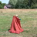 Harry sets up a blanket on the green, A Village Hog Roast, Little Green, Thrandeston, Suffolk - 24th June 2018