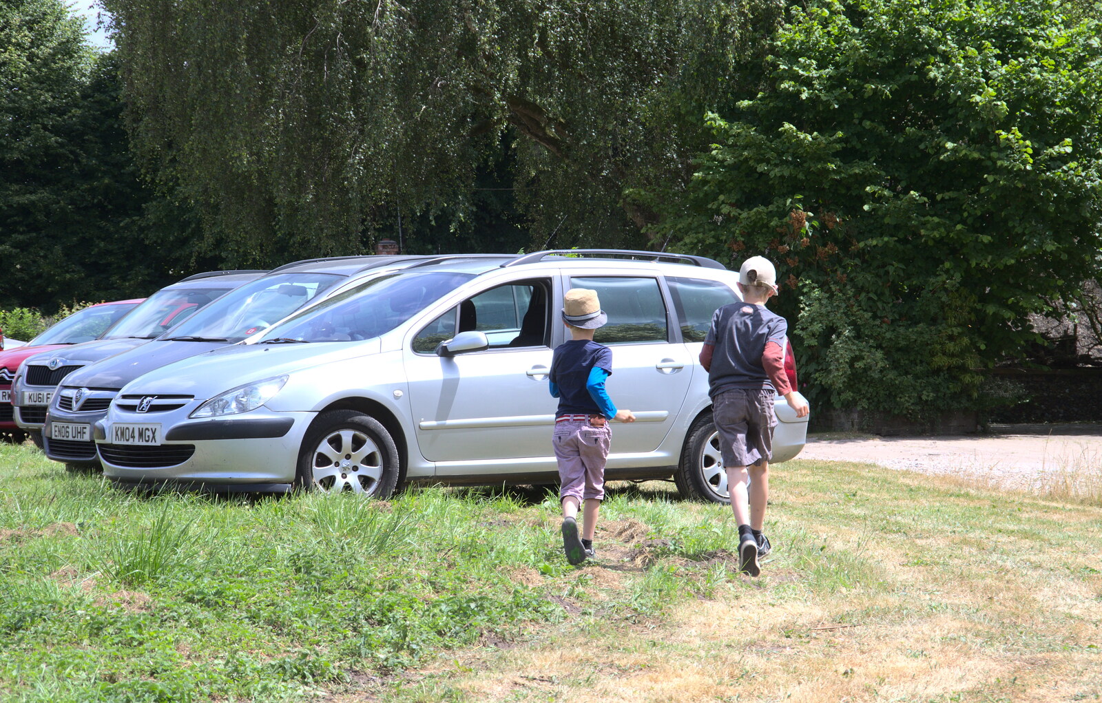 The boys run over to Grandad's car for sweets from A Village Hog Roast, Little Green, Thrandeston, Suffolk - 24th June 2018