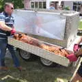 The crispy hog is hauled out, A Village Hog Roast, Little Green, Thrandeston, Suffolk - 24th June 2018