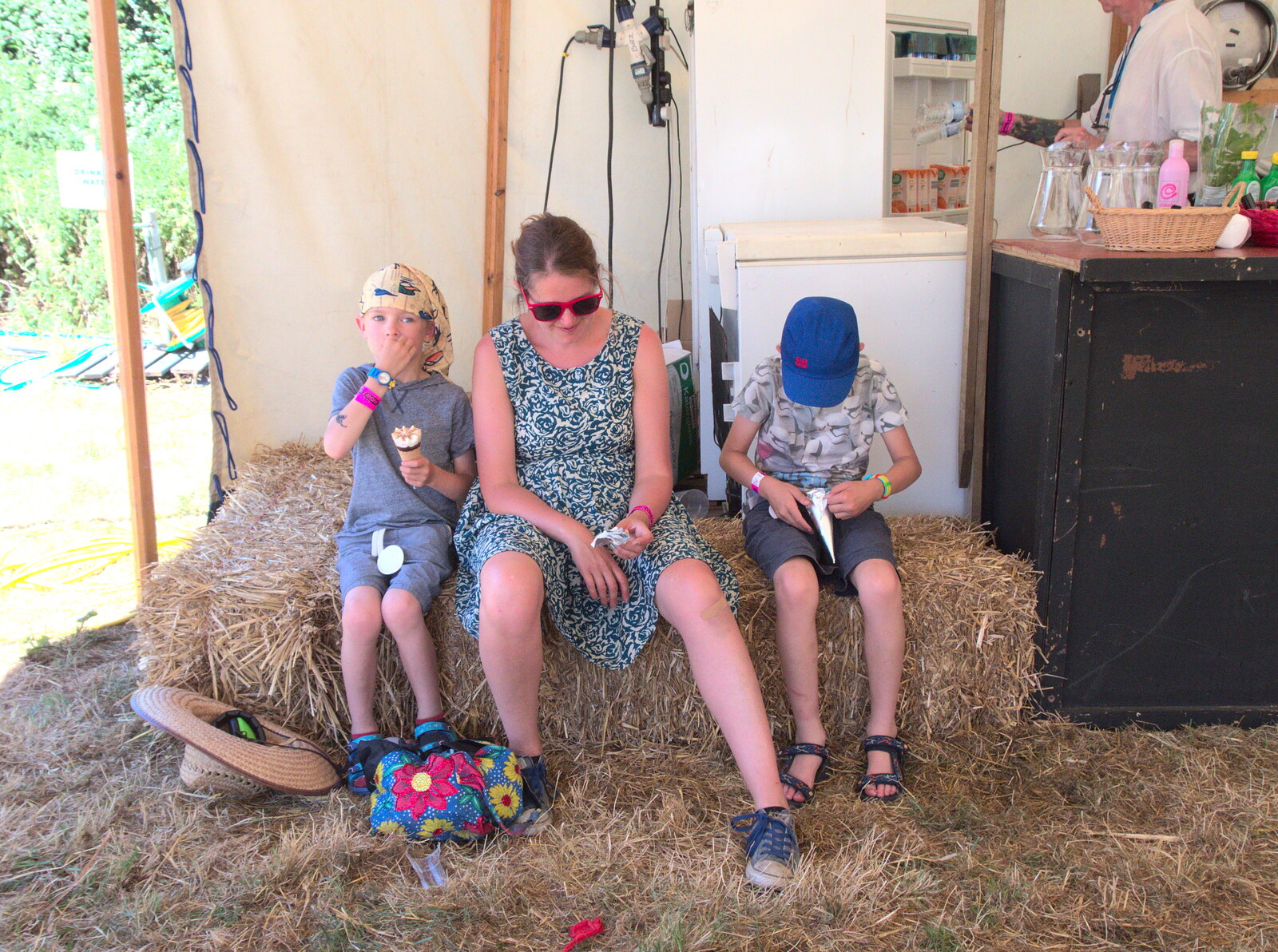 Isobel and the boys sit on bales from WoW Festival, Burston, Norfolk - 29th June - 1st July 2018