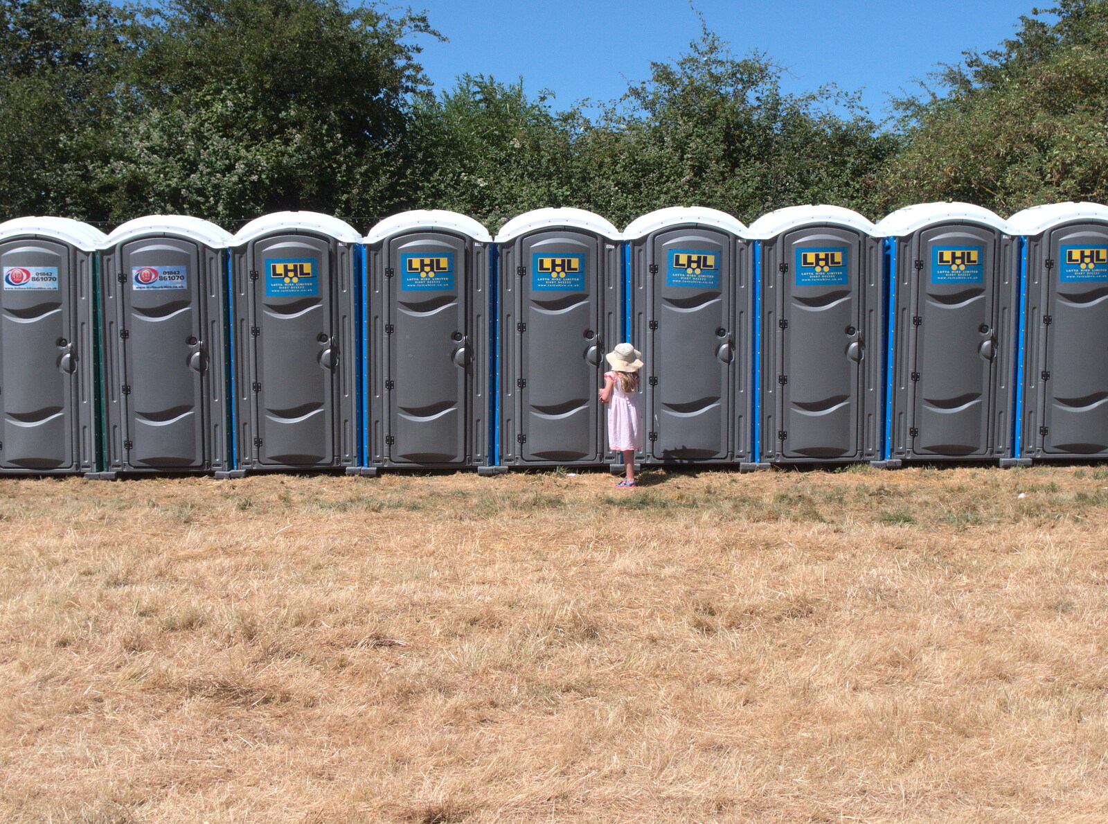 A small girl, and a lot of toilets from WoW Festival, Burston, Norfolk - 29th June - 1st July 2018