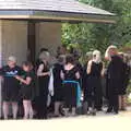 The choir shelters under the roof of the public bogs, Diss Fest, The Park, Diss, Norfolk - 22nd July 2018