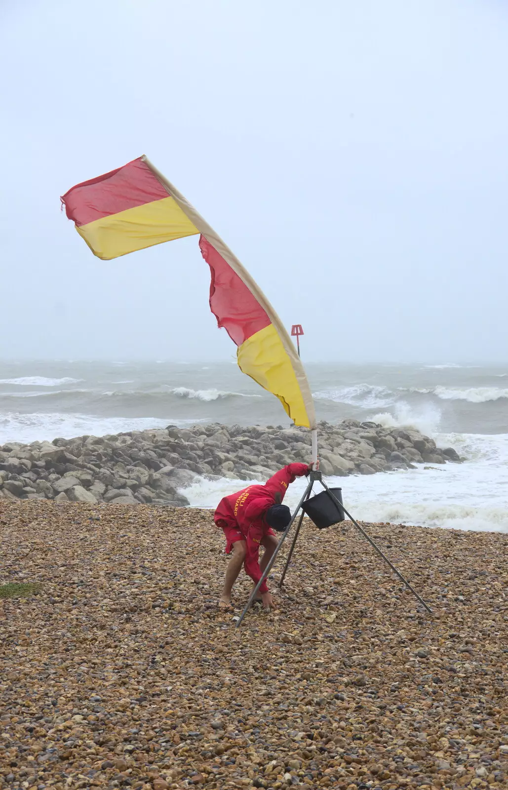 The lifeguard puts the flag back up, from Blustery Beach Trips, Walkford and Highcliffe, Dorset - 29th July 2018