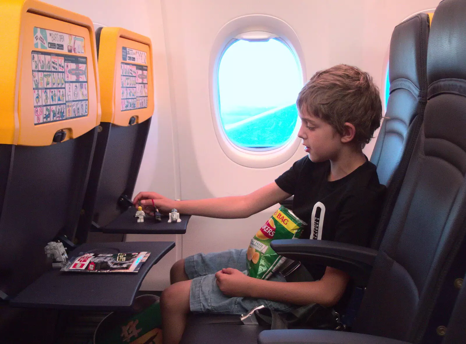 Fred plays with Lego on the plane, from A Trip to Da Gorls, Monkstown Farm, County Dublin, Ireland - 4th August 2018