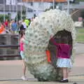 Children play in a giant sea-urchin sculpture, The Dún Laoghaire 10k Run, County Dublin, Ireland - 6th August 2018