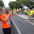 A woman from the US waits for her sister, The Dún Laoghaire 10k Run, County Dublin, Ireland - 6th August 2018