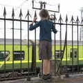 Fred watches a DART rumble past, The Dún Laoghaire 10k Run, County Dublin, Ireland - 6th August 2018