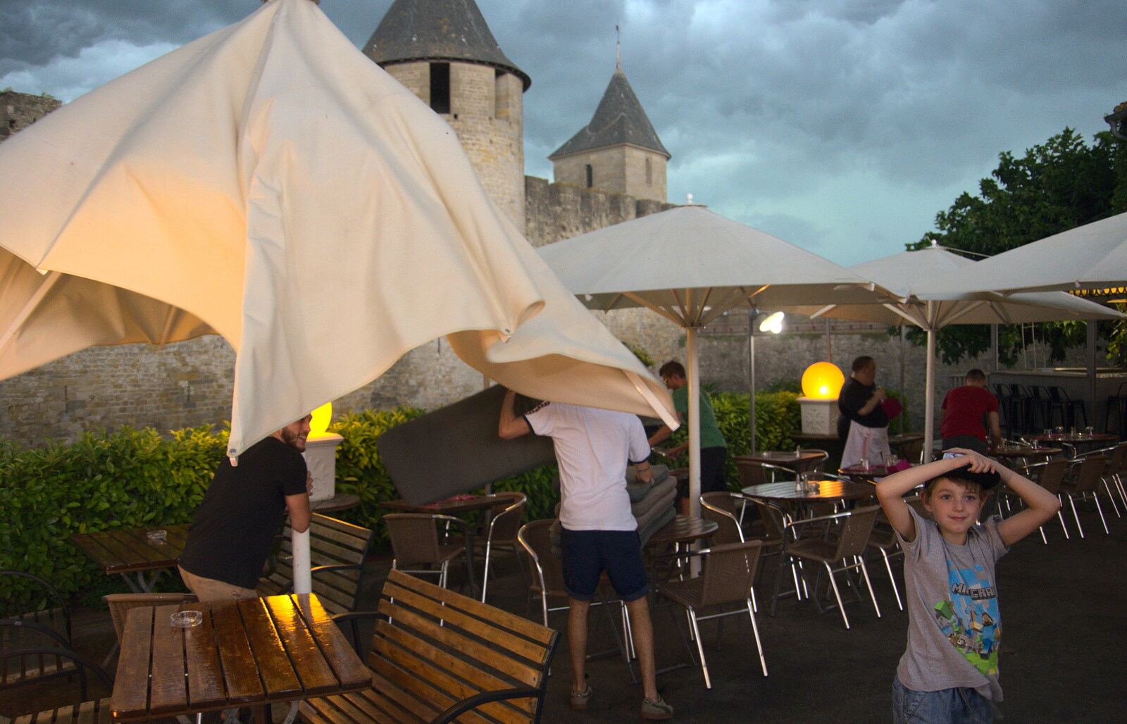 The bar staff take the parasols in from A Trip to Carcassonne, Aude, France - 8th August 2018