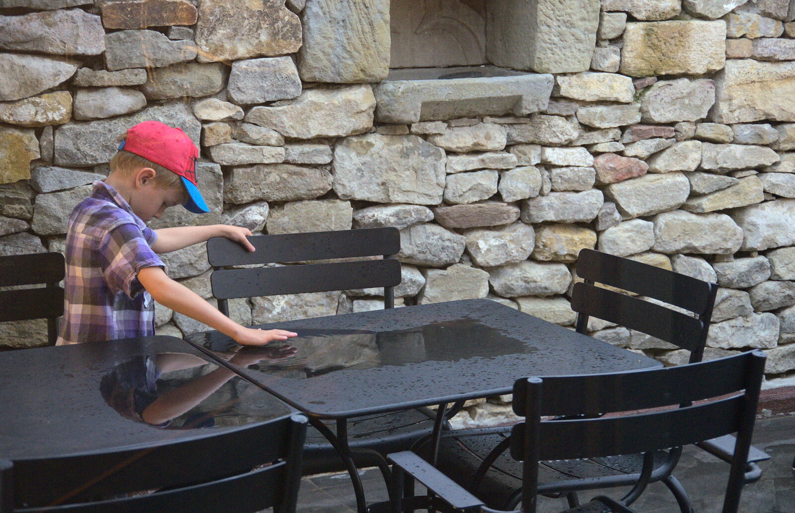 Harry pokes standing water on a table from A Trip to Carcassonne, Aude, France - 8th August 2018