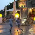 Fred and Harry mess around in the wet square, A Trip to Carcassonne, Aude, France - 8th August 2018