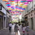 Isobel, Harry and Fred wander under the parapluies, A Trip to Carcassonne, Aude, France - 8th August 2018