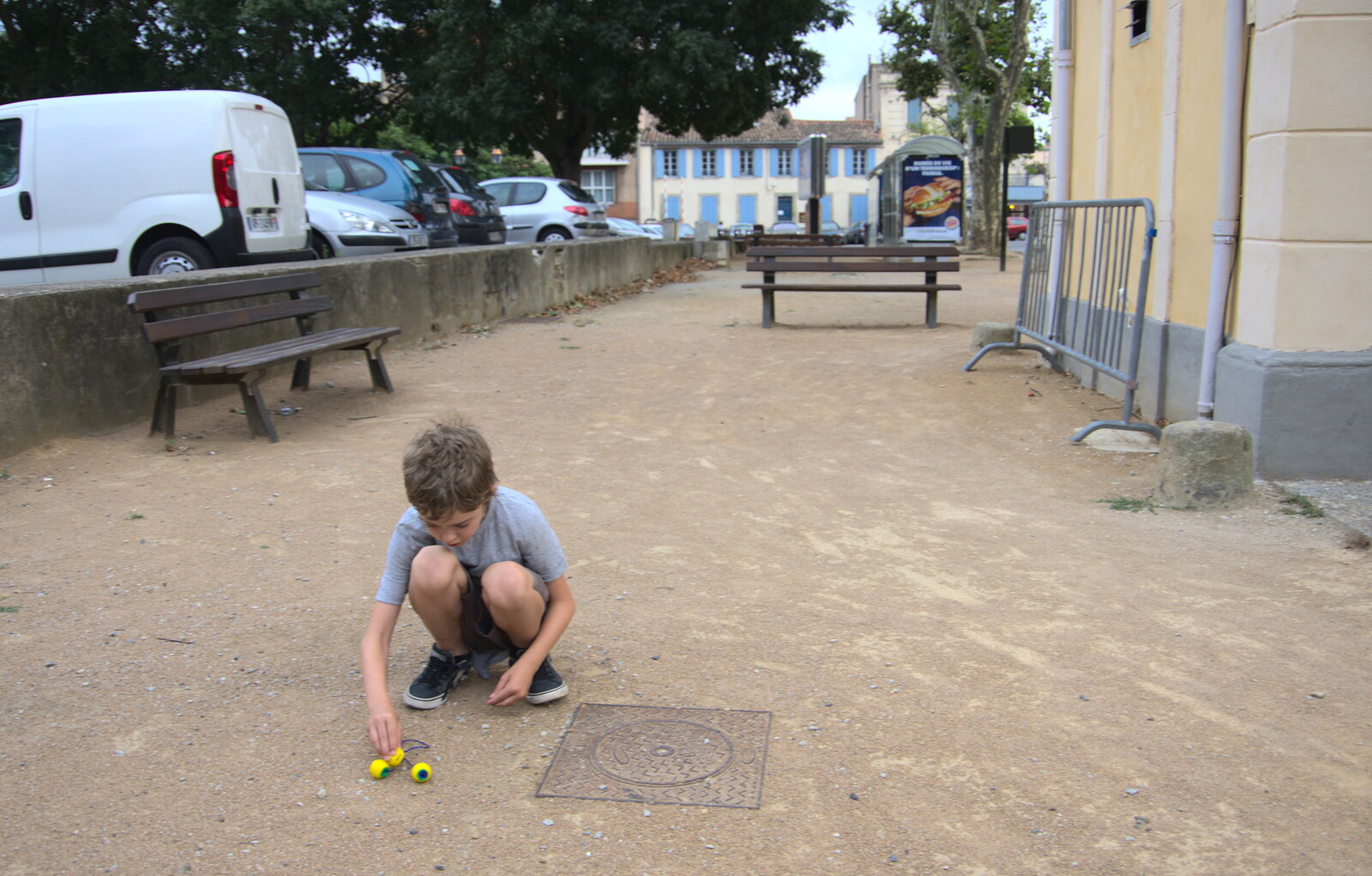 Fred plays with his jacks outside from A Trip to Carcassonne, Aude, France - 8th August 2018