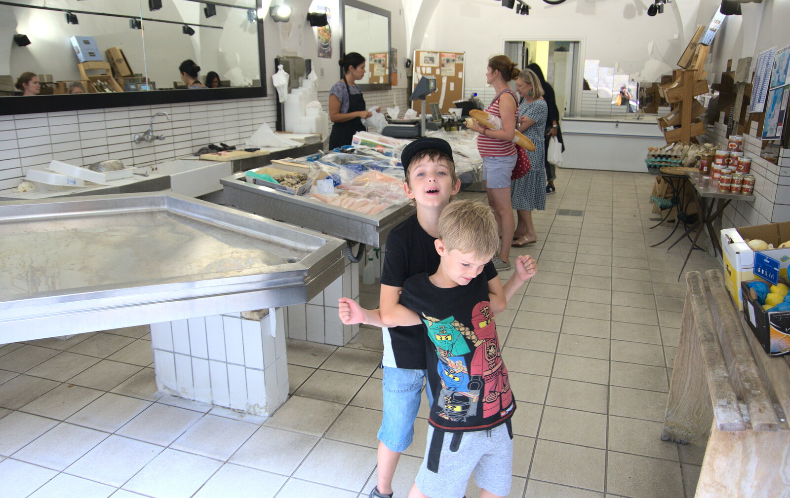 Fred and Harry mess around in a fish shop from Abbaye Sainte-Marie de Lagrasse and The Lac de la Cavayère, Aude, France - 10th August