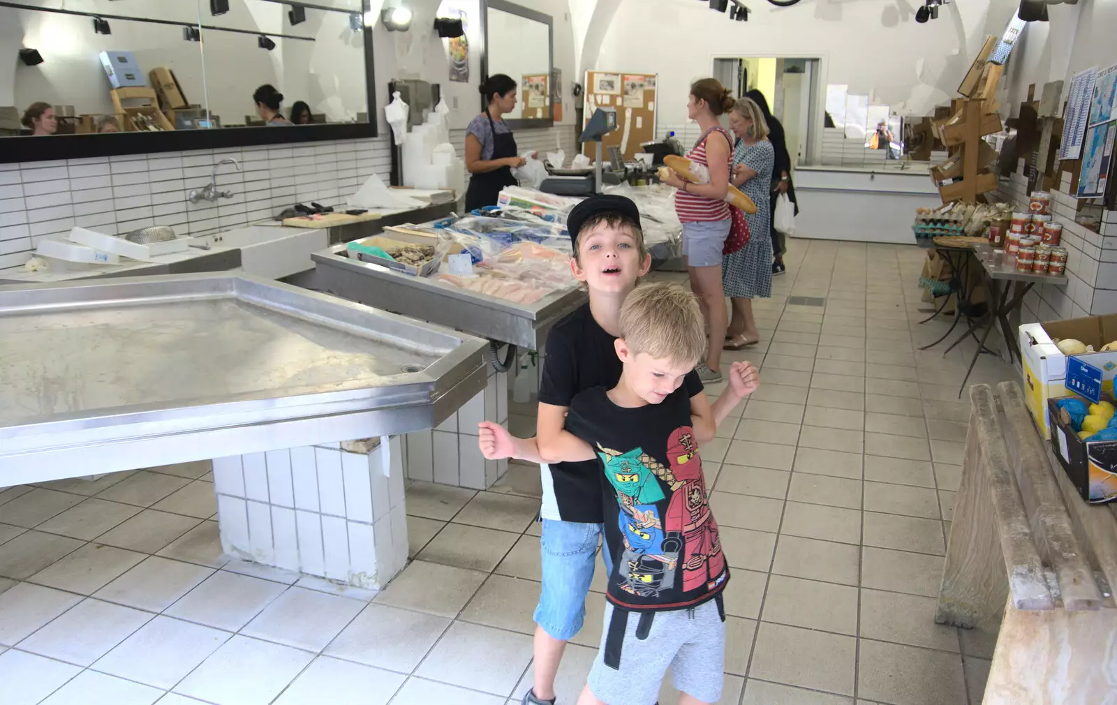 Fred and Harry mess around in a fish shop, from Abbaye Sainte-Marie de Lagrasse and The Lac de la Cavayère, Aude, France - 10th August