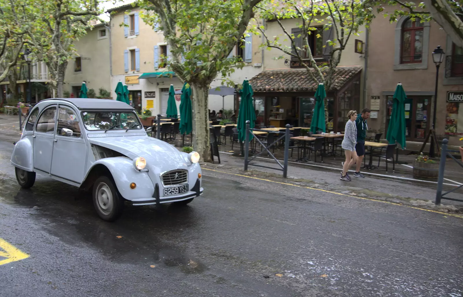 How French could it get: a 2CV trundles past, from Abbaye Sainte-Marie de Lagrasse and The Lac de la Cavayère, Aude, France - 10th August