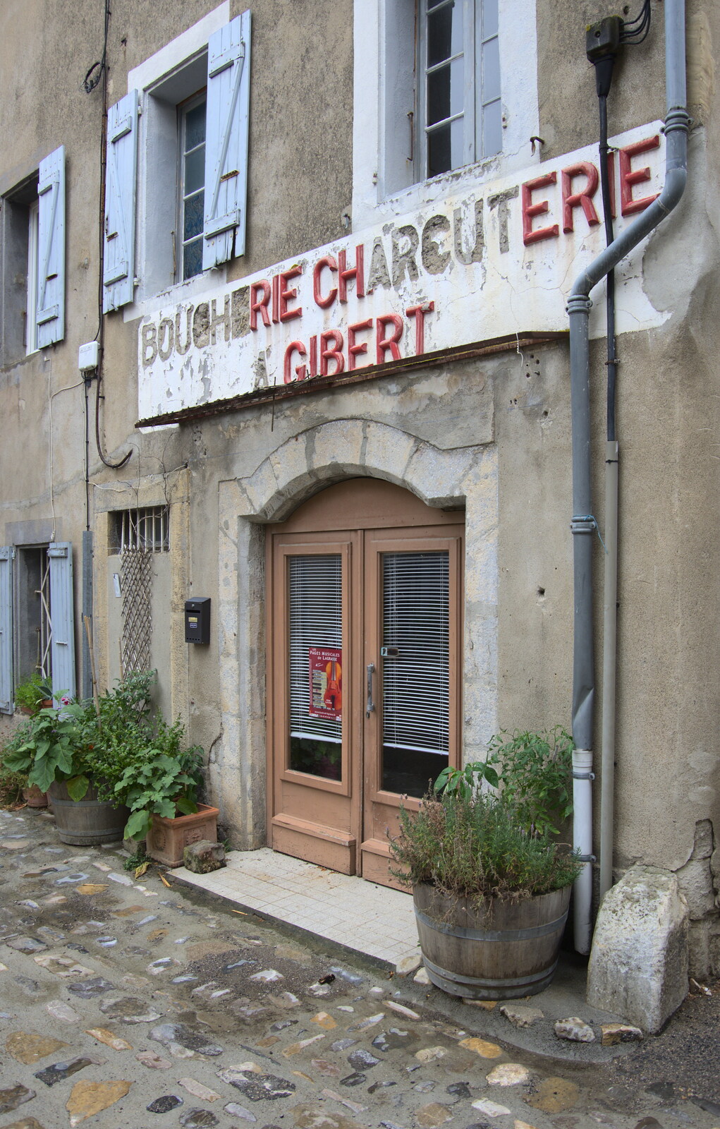 Quaintly-decaying shop sign from Abbaye Sainte-Marie de Lagrasse and The Lac de la Cavayère, Aude, France - 10th August