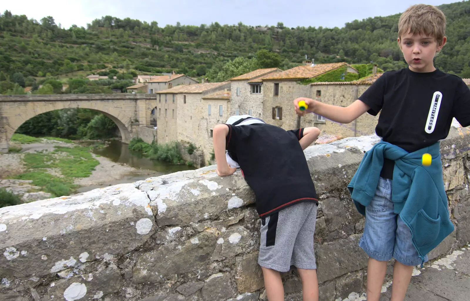 Harry peers over the bridge, from Abbaye Sainte-Marie de Lagrasse and The Lac de la Cavayère, Aude, France - 10th August