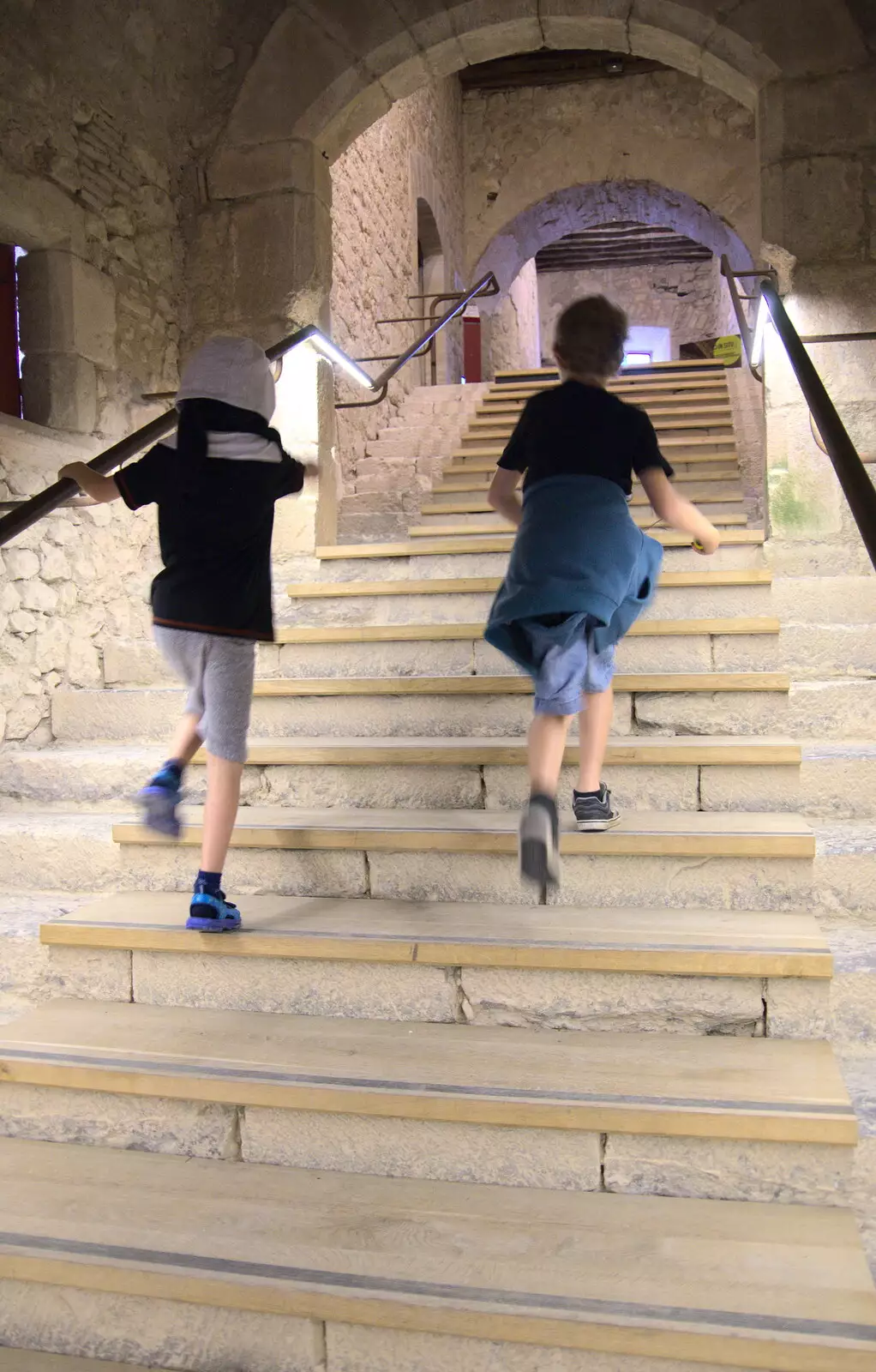 The boys run up some steps, from Abbaye Sainte-Marie de Lagrasse and The Lac de la Cavayère, Aude, France - 10th August