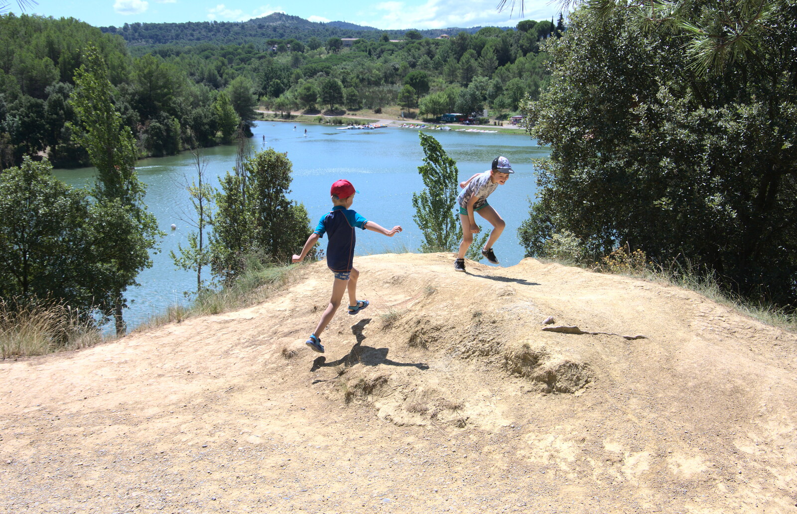 The boys run around on top of a hill from Abbaye Sainte-Marie de Lagrasse and The Lac de la Cavayère, Aude, France - 10th August